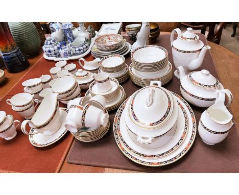 A comprehensive Spode 'Orient' Y8520 dinner, tea and coffee service, white with border of gilt, green, orange and blue, 84 pi
