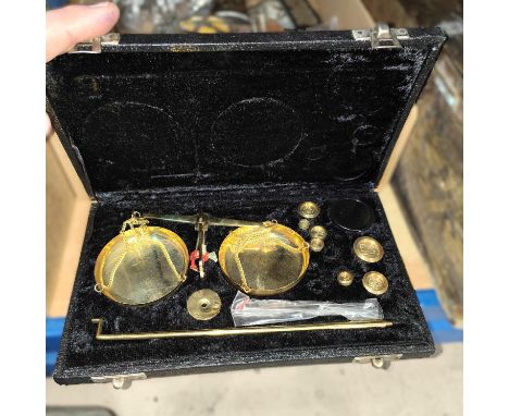 A set of portable balance scales with weights, box. 