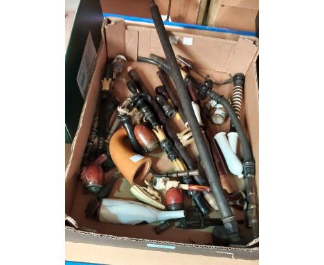 A collection of ceramic and other pipe parts, novelty revolver etc, German etc 