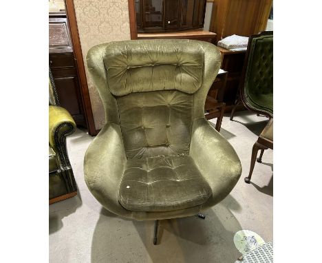 A 1960's 'Egg' swivel armchair re-upholstered in green fabric (sold as design collector item only) 
