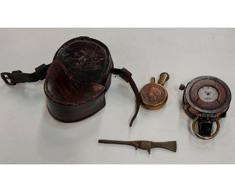 A French trench art lighter; a military compass with leather case 