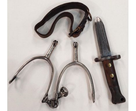 A British Army bayonet with shortened blade, 23cm overall and a pair of steel spurs, a leather strap with engraved plate 
