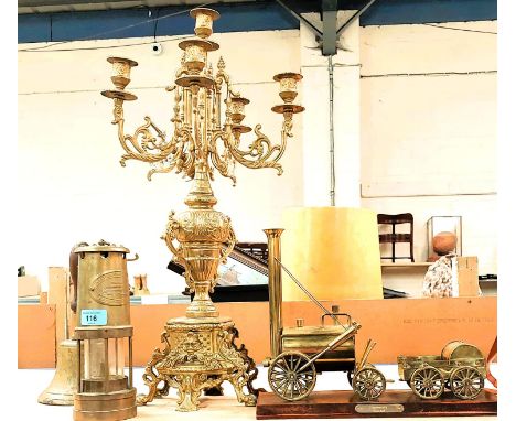 A brass miner's lamp, British Coal Mining Company, Bell with military Arrow, a brass coal steam model and a brass candelabra 