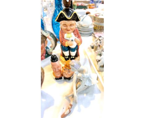 A Beswick Laurel &amp; Hardy salt and pepper cruet on stand, a Toby Jug lamp, a Lladro ballerina. 