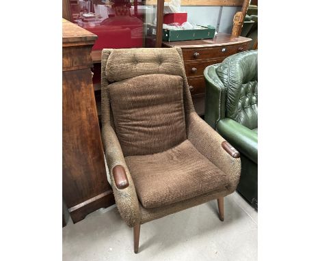 A mid 20th century armchair with ribbed brown upholstery and mahogany arm pads (sold as a collector's item only)