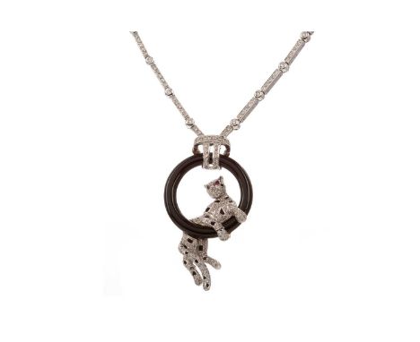 RUBY AND DIAMOND PANTHER NECKLET,the diamond set panther with ruby eyes, upon a black hardstone ring, to a diamond set neckle