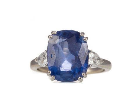 CERTIFICATED CEYLON SAPPHIRE AND DIAMOND RING,the cushion cut sapphire of approximately 8.94 carats, with accompanying Gem Pa