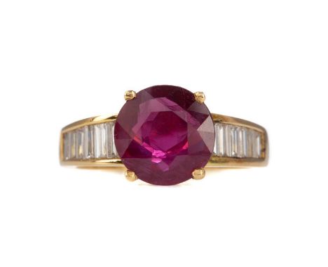RUBY AND DIAMOND RING,the round ruby of approximately 3.26 carats, on diamond set shoulders totalling approximately 0.85 cara