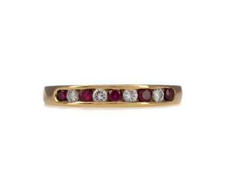 RUBY AND DIAMOND BAND,set with round rubies and diamonds, in eighteen carat gold, size N 1/2, 3.1gCondition report: Generally