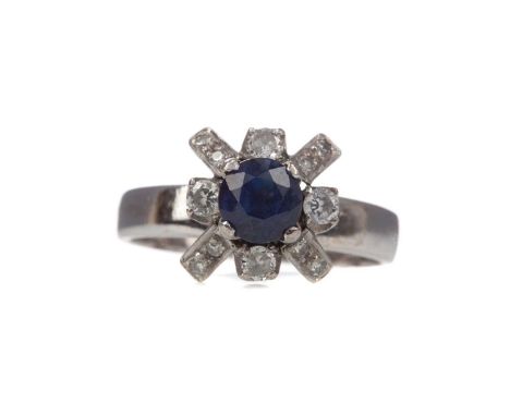 SAPPHIRE AND DIAMOND RING,the high set round sapphire bordered by round brilliant cut diamonds totalling approximately 0.30 c