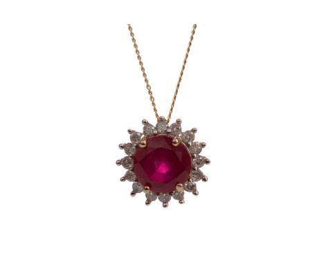 RUBY AND DIAMOND PENDANT,set with a round ruby within a round brilliant cut diamond halo, in nine carat gold, 1.3gCondition r