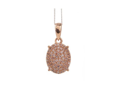 PINK DIAMOND PENDANT,the pave set round light pink diamonds, to a rose gold bezel, on a white gold chain marked 375, 1.5g