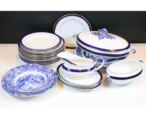 Royal Doulton flow blue and gold plates and vegetable serving tureens together with Churchill and Woods Ware Willow pattern s