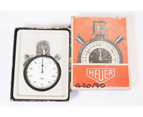 A vintage Swiss made Heuer stopwatch within original retail box. 
