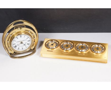 A novelty brass mantel clock in the form of a horseshoe inscribed “stable requisites” h:16cm and a French brass desk world cl