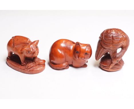 Three carved wood netsuke figures to include crane, cat and pig