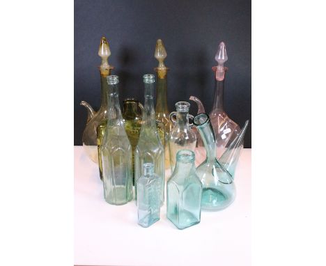 20th century coloured glass wine and ice decanters together with a mid century studio glass bottle and other glass bottle exa