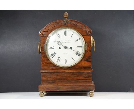 A rosewood mantel clock, the circular dial with a later signature, the movement with later engraving – “James McCabe, Royal E