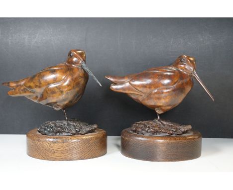 A pair of bronze models of snipe, initialled “C.D” and dated 2015, each 18cm hight and mounted on oval oak bases (2)