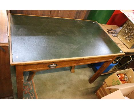 Mid 20th Century oak leather topped desk with single drawer with cup handle, raised on block legs. Measures 75 x 122 x 69cm.