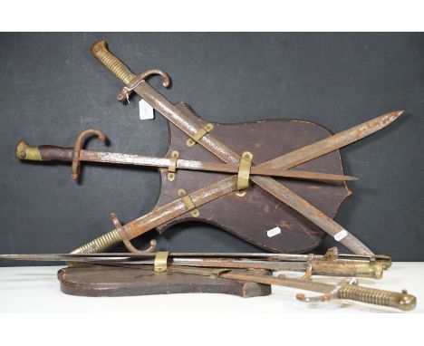 Two WWI French Gras bayonets each with 52cm blade together with four WWI French Chassepot bayonets each with approx. 57cm yat