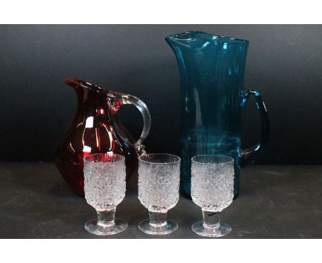 Whitefriars kingfisher blue glass lemonade jug, 26cm high, Whitefriars ruby red glass sparrow beak jug, 18cm and three Whitef