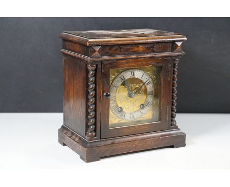 A “Carolean” style oak mantel clock, with a French movement, striking on gongsh: 20cm