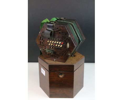 A 19th century rosewood 48 key concertina, with maker's label 'Mr Joseph Skates New Bond Street London', in original hexagona