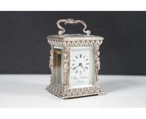 A miniature silver cased carriage timepiece by Charles Frodsham, the dial flanked by caryatids, London 1977 to commemorate Si