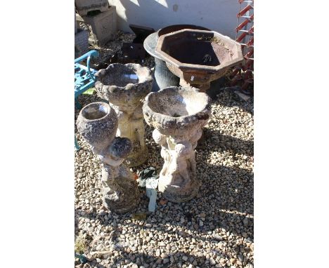 Pair of reconstituted stone cherub water fountains together with a cherub and urn statue and a cast iron planter, tallest mea