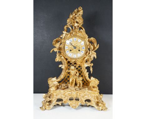 Raingo Freres, Paris, a 19th century ormolu mantel clock in a cast rococo case with figures of two boys bird nesting, the cas
