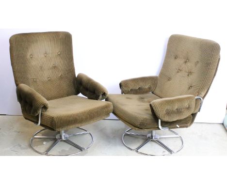 Pair of 1970s swivel arm chairs in the manner of Terrence Conran for Habitat. The chairs with button backs and arms, upholste