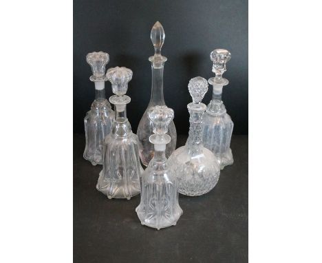 Group of four Victorian blown glass decanters in various sizes, tallest 34cm, together with a floral pattern etched glass win