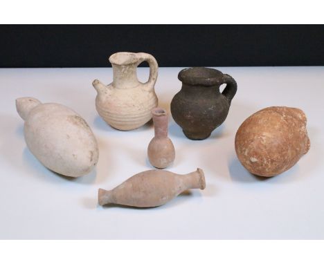 Antiquities - A collection of ancient vessels, including a Palestinian pottery ewer, c.3000-2500 B.C. of ovoid form with seve