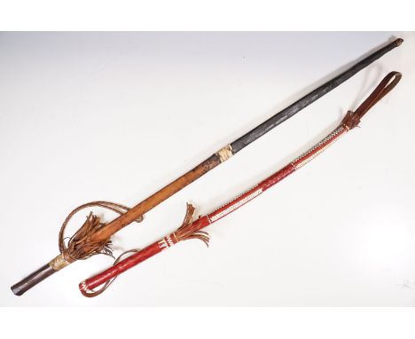 Leather riding crop with woven detail, L 87cm together with sword with leather sheath case, L 89cm