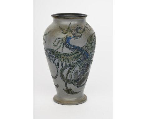 A Martin Brothers stoneware Dragon vase by Robert Wallace Martin, baluster form, incised with a dragon fighting a serpent, in