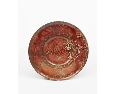 A William De Morgan lustre charger by Charles Passenger, painted with a classical dolphin to the well, the rim with a frieze 
