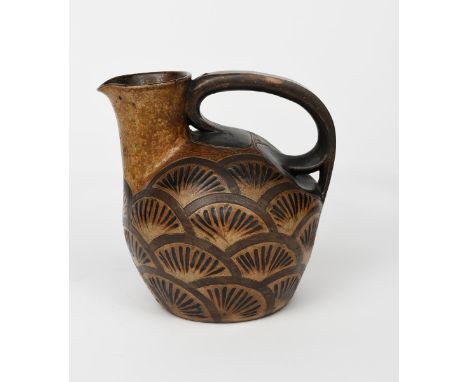 A large and early Martin Brothers stoneware jug by Robert Wallace Martin, dated 1881, ovoid with over-slung handle, incised w