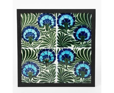 Gillow a William De Morgan four tile panel, each tile painted with two carnation design, in shades of blue, turquoise and  gr