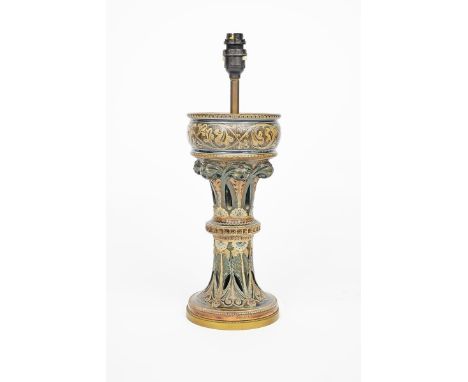 A Martin Brothers stoneware lamp base by Robert Wallace Martin, pierced and cast architectural form, glazed in shades of brow