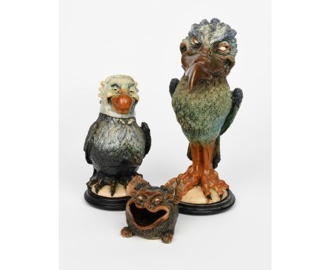 A tall pottery bird jar and cover by R C Kew, dated 1993, inspired by the Martin Brothers birds, modelled with long, hooked b