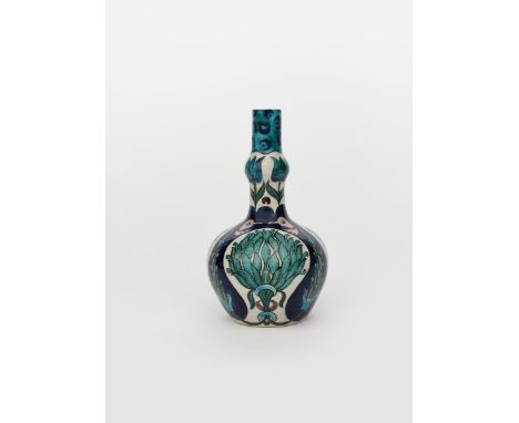 A William De Morgan Persian bottle vase, ovoid with knopped neck, painted with panels of foliage, in blue, turquoise and gree