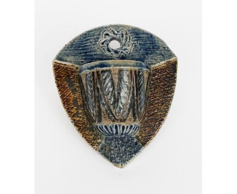 An early Martin Brothers stoneware wall vesta by Robert Wallace Martin, dated 1875, shield shaped, with cylindrical container