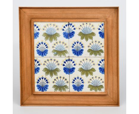 'Daisy' a Dutch four tile panel designed by William Morris, painted with clumps of flowers in shades of blue, green and yello