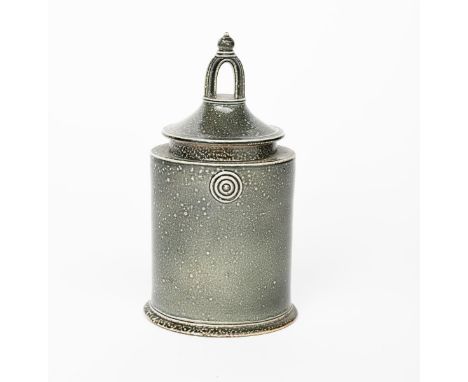 ‡ Walter Keeler (born 1942) a salt-glaze stoneware storage jar and cover, elliptical form, the tapering cover with tall pierc