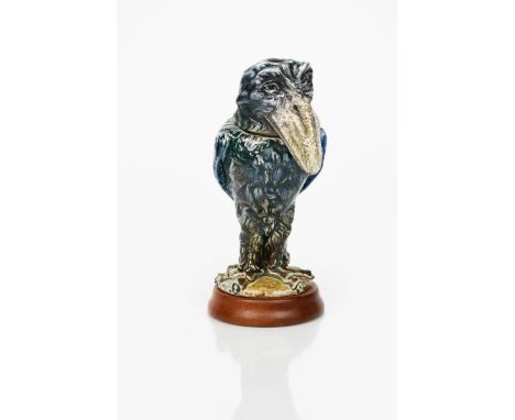 A Martin Brothers stoneware bird jar and cover by Robert Wallace Martin, dated 1907, modelled with long beak and staring gaze