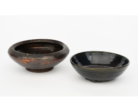 Bernard Leach CBE (1887-1979) a Leach pottery stoneware bowl, footed form, covered in a running hare's fur glaze, and another