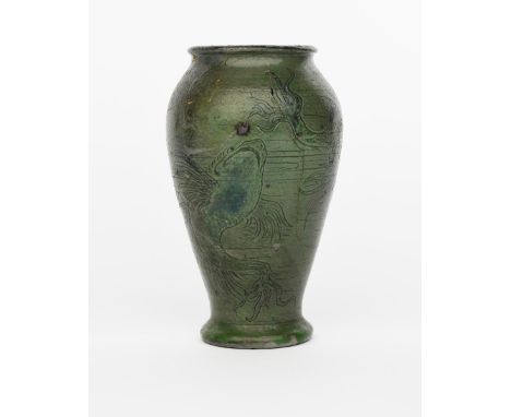 A Martin Brothers stoneware aquatic vase by Robert Wallace Martin, baluster form, incised with grotesque fish swimming, glaze