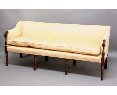 HEPPLEWHITE STYLE MAHOGANY SOFA, 19th century, the padded back with down swept upholstered and carved arms, on tapering cylin