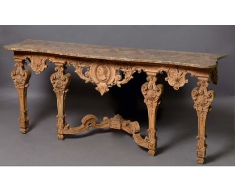 LOUIS XIV STYLE CARVED WOOD CONSOLE TABLE, 19th century, the serpentine marble top on a base with a central profile bust surr